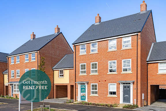 A row of houses with a sign offering a free month of rent.
