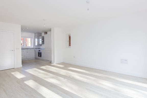 A white room with sunlight coming through the window.