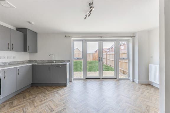 A kitchen with a sink and a window.