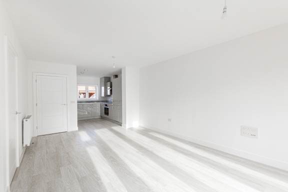 A white room with light coming through the window.