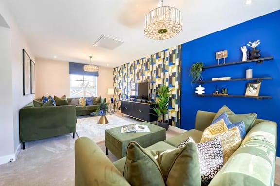 A living room with a green couch and a coffee table.