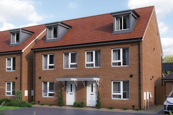 A red brick house with a white door and windows.