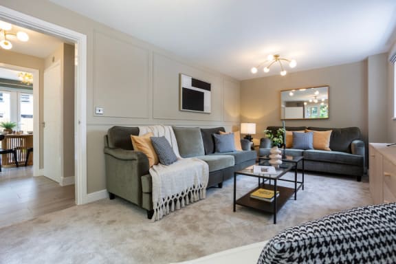 a living room with couches and a coffee table