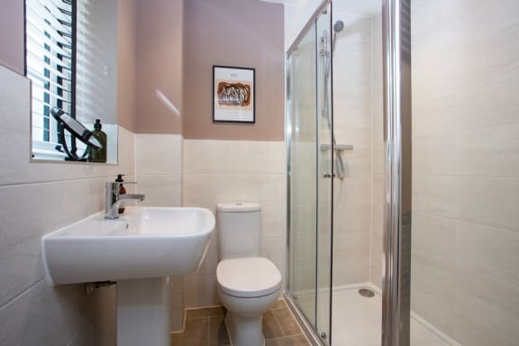 a bathroom with a sink toilet and a shower
