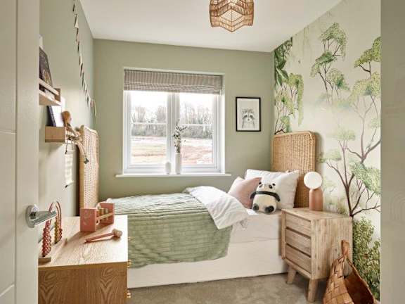 A bedroom with a bed, nightstand, and a window with blinds.