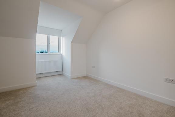 A room with a window and a radiator.