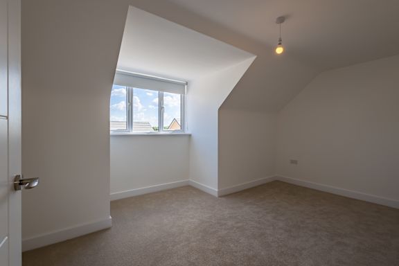 A room with a window and a door.