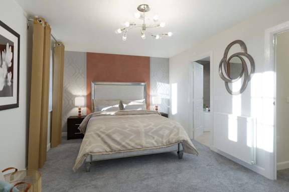 A bedroom with a large bed and a chandelier.