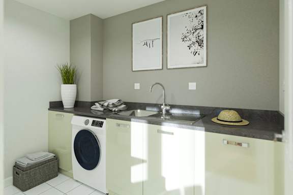 A small laundry room with a washer and dryer.