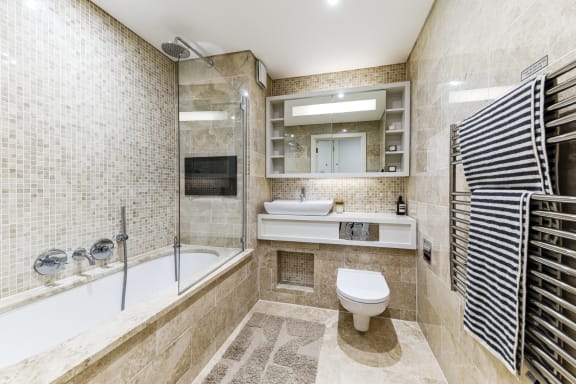 a bathroom with a shower toilet and a sink
