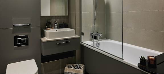 a bathroom with a sink toilet and a tub