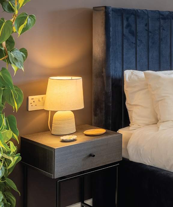a bed with two pillows on top of it