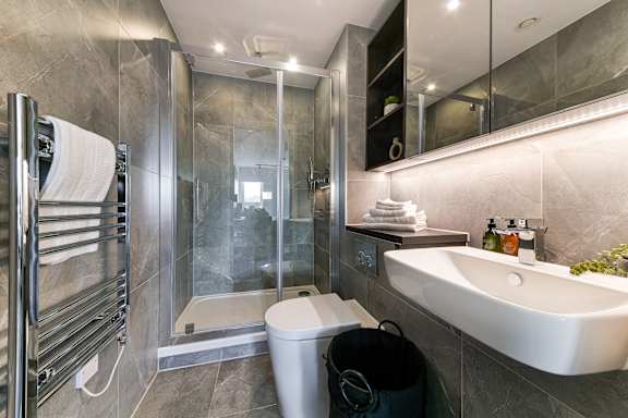 a bathroom with a sink toilet and a shower