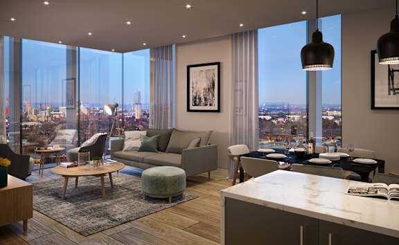 A modern living room with a view of the cityscape outside the large windows.