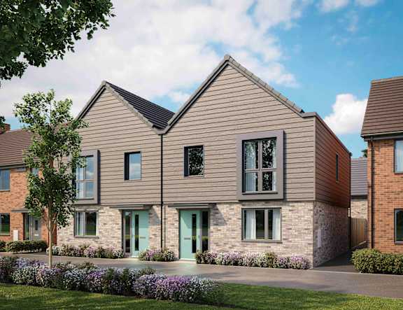 A modern house with a grey front and a green door at The Foundry Apartments, Bordon