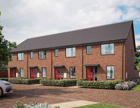A red brick house with a grey car parked in front at The Foundry Apartments, Bordon, GU35 9FE