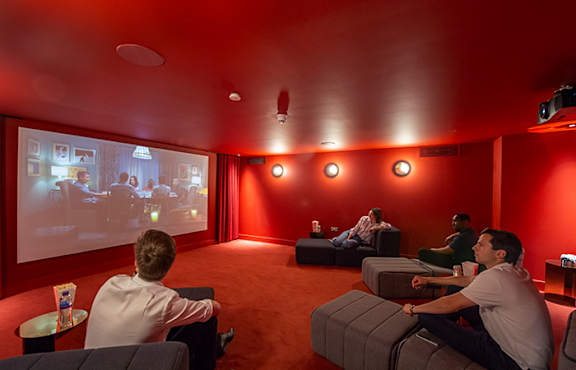 People watching in cinema room at The Lark, London