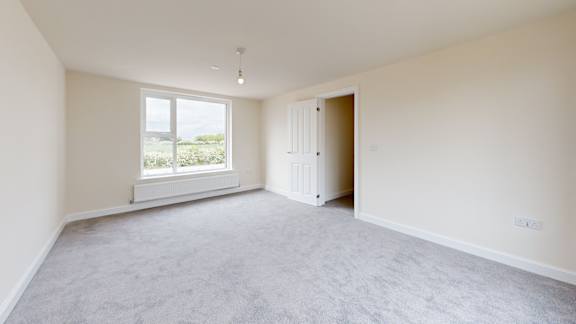 A room with a window and a door.