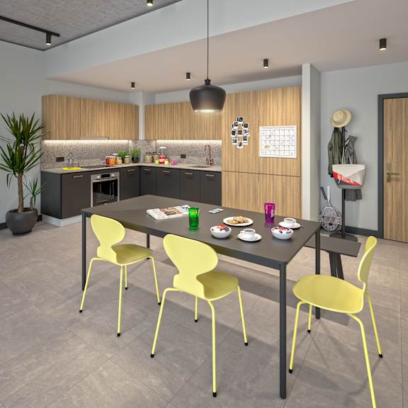 A modern kitchen with a dining table and chairs at Beton Apartments, Wembley