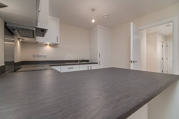 A modern kitchen with a large island in the middle.