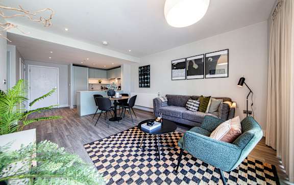 A living room with a black and white checkered floor.