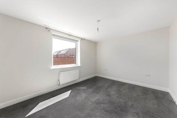 A room with a window and a radiator on the wall at Origins Apartments, Cambridge, CB3 0UX