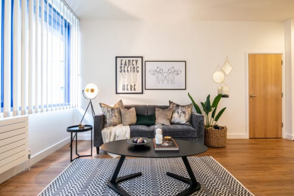 a living room with a couch and a coffee table at The Keel Apartments, Liverpool