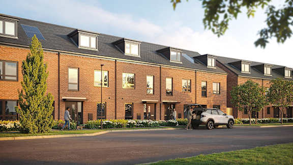 A modern brick building with solar panels on the roof.