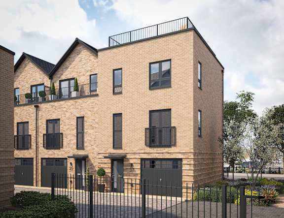 A modern brick building with black railings and windows.