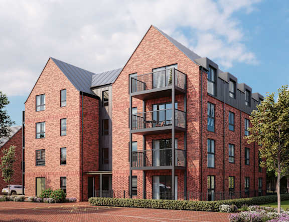 A red brick building with a black metal balcony at The Woodlands Apartments, Milton Keynes