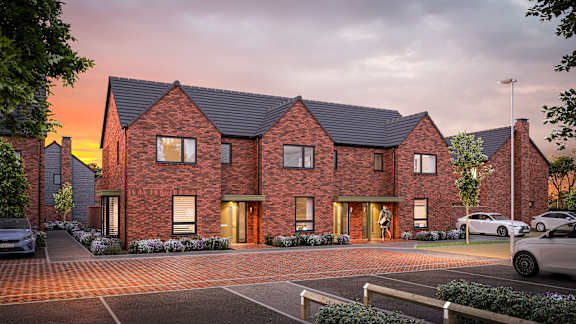 A modern brick house with a driveway and cars parked in front. at The Woodlands Apartments, Milton Keynes