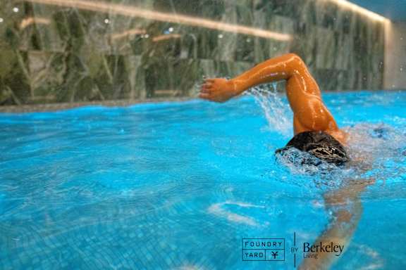 A man swimming in a pool.