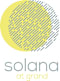 A graphic with a yellow circle and the words "solana at grand" below it.