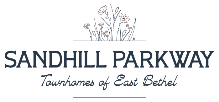 the logo or sign for the hotel at Sandhill Parkway Townhomes Apartments, East Bethel, Minnesota