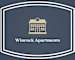 A logo for Winrock Apartments featuring a building.
