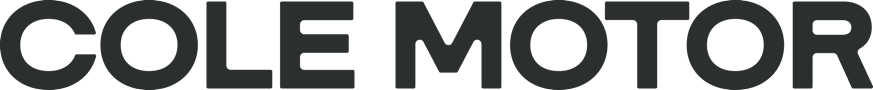 Cole Motor vertical logo in dark engine color featuring bold modern wordmark typography on black background
