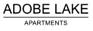 The image is a logo for Adobe Lake Apartments.
