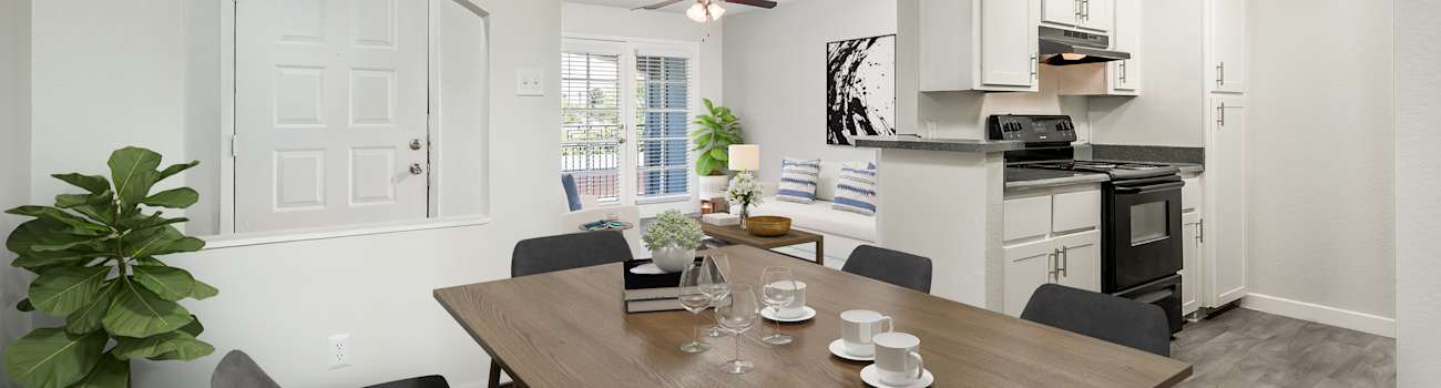 Furnished dining area shown — representative home at The Naya Apartments.