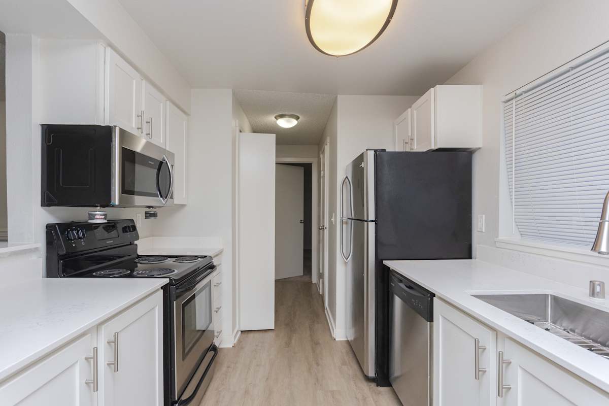 Ellyson Apartment Homes kitchen with black appliances - Tacoma, WA