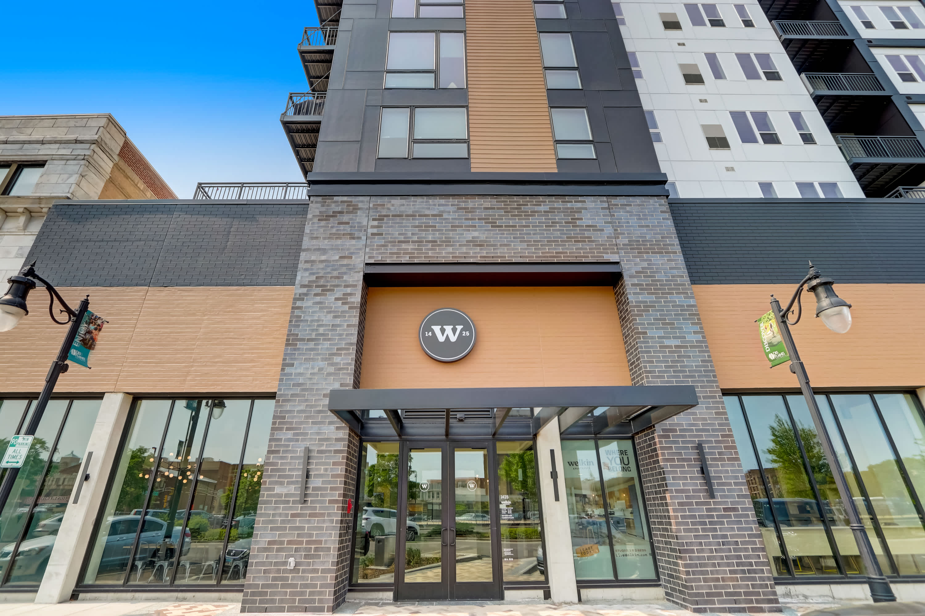 Welkin Apartments building exterior with W signage - Des Plaines, IL