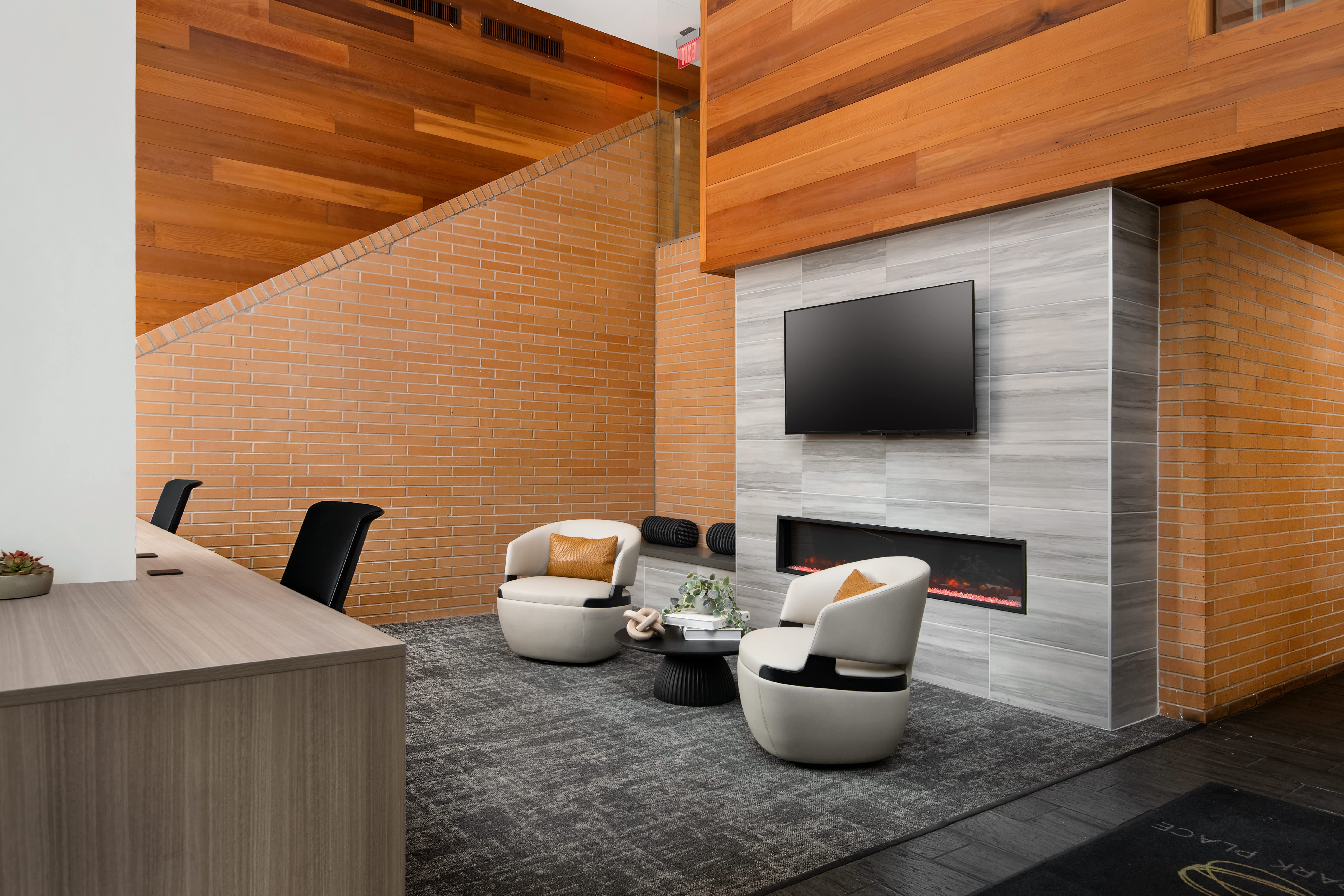 Oak Park Place resident lounge with fireplace and TV - Oak Park, IL
