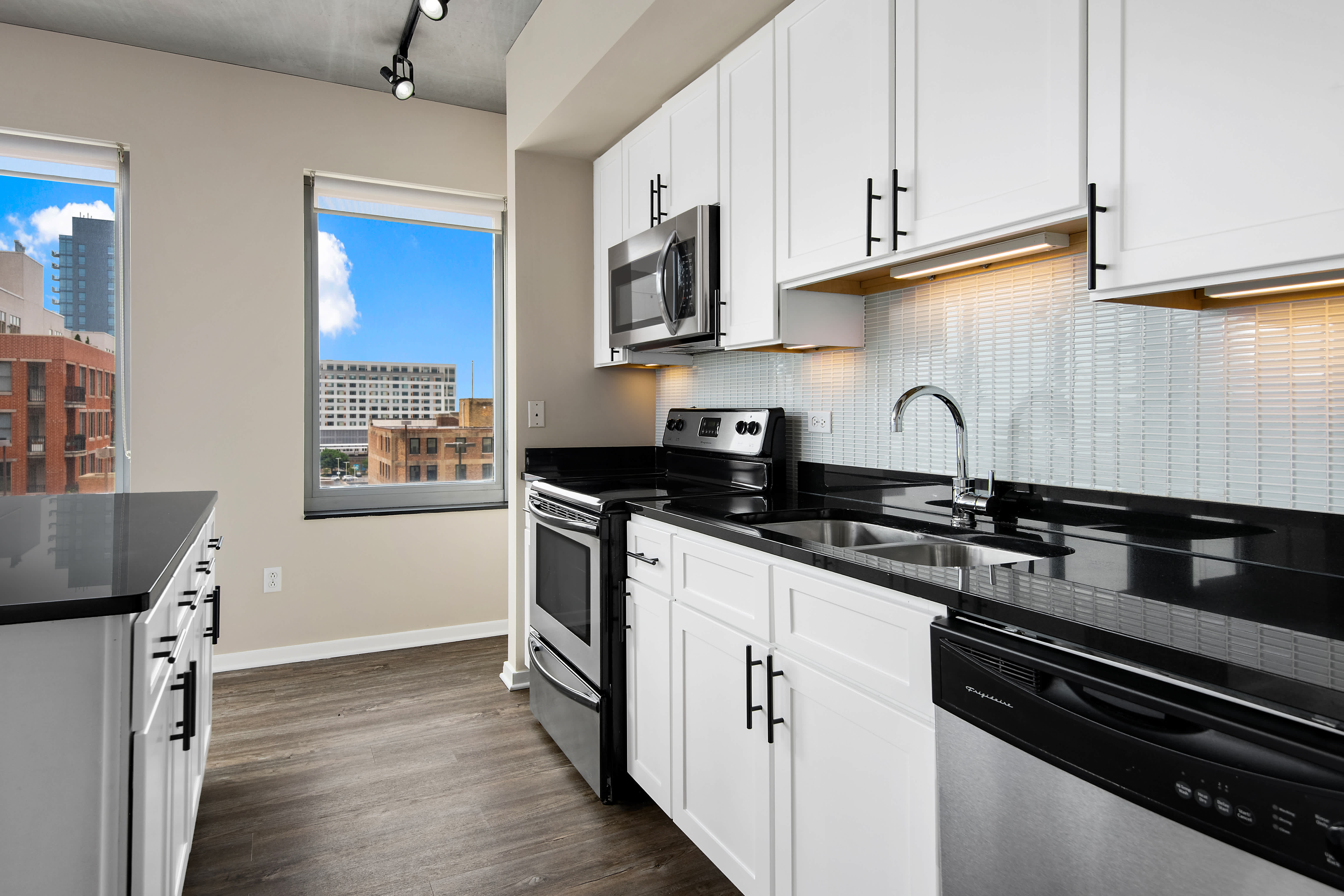 Oak Park Place apartment kitchen with black countertops - Oak Park, IL