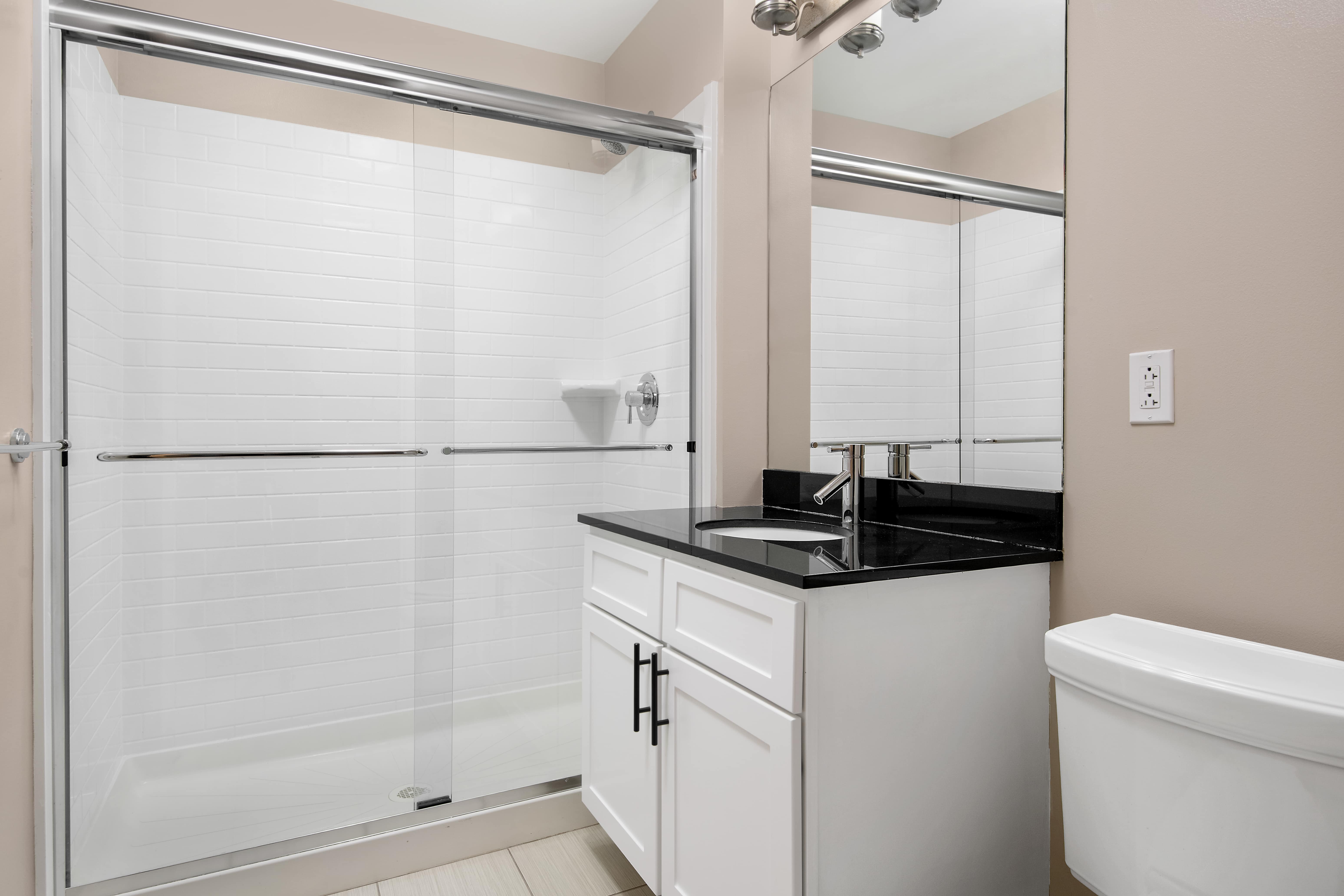 Oak Park Place apartment bathroom with tub and sink - Oak Park, IL