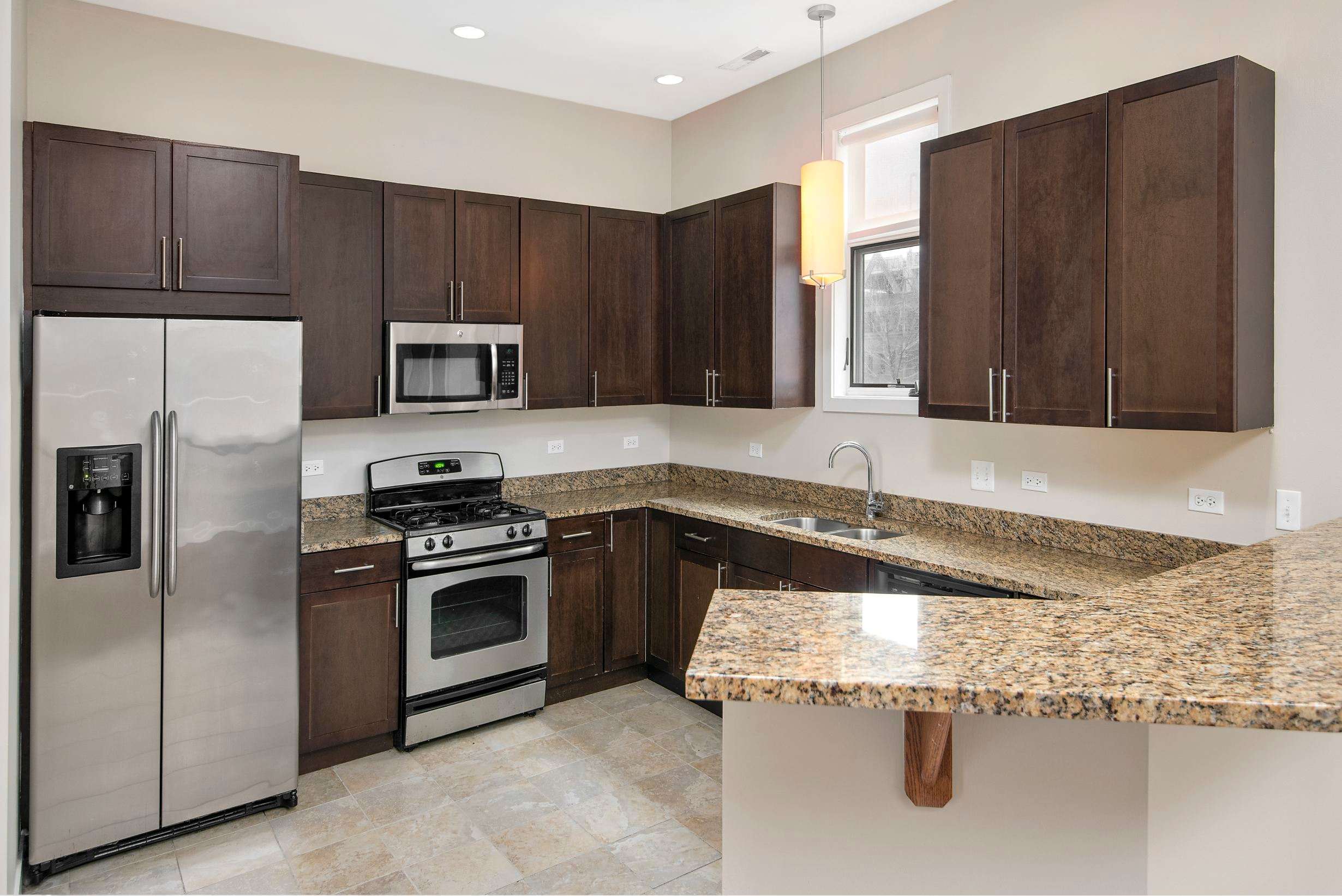 Oak Park Place apartment kitchen with stainless appliances - Oak Park, IL