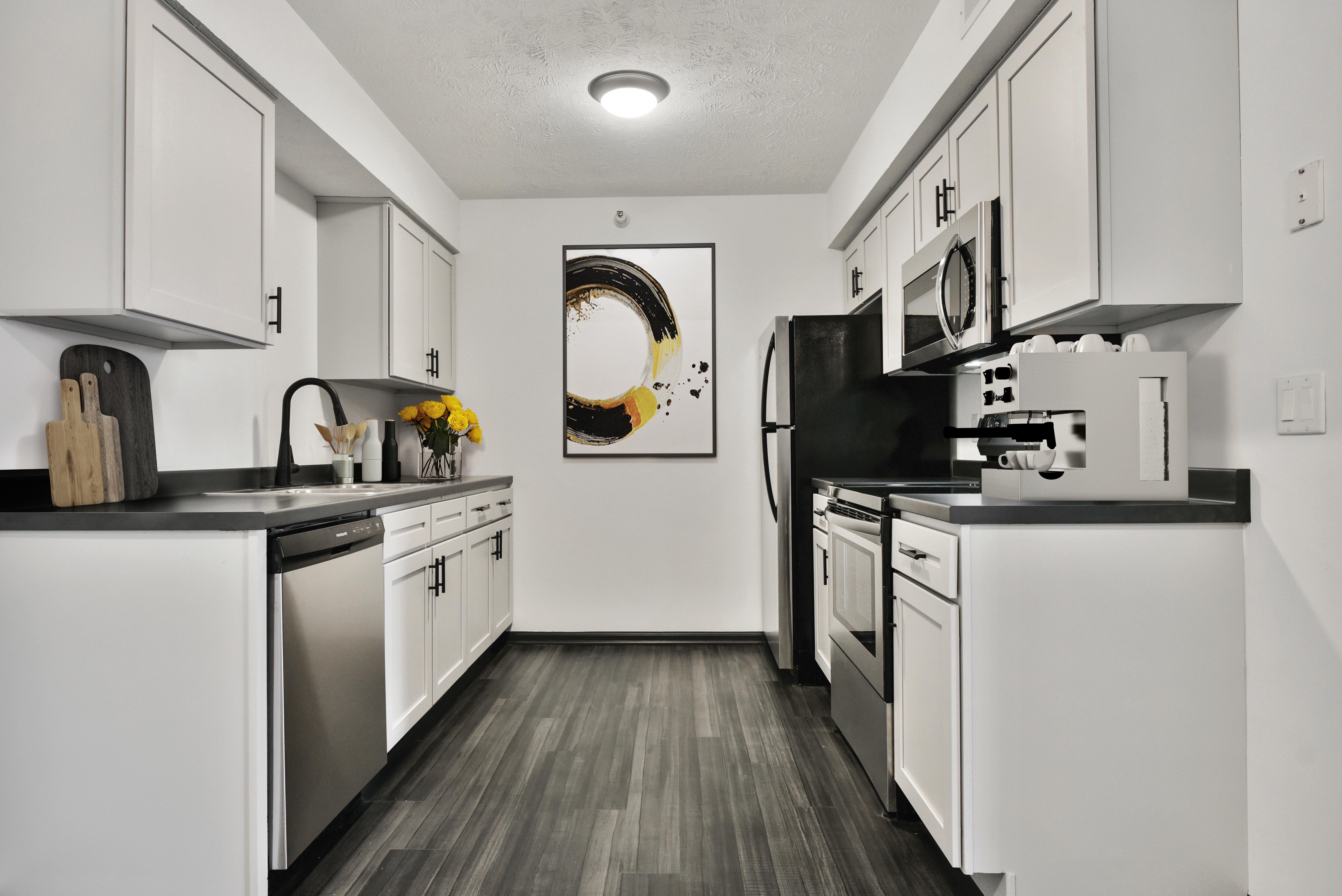 Greenfield Apartments kitchen with white cabinets - Omaha, NE