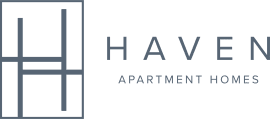 A green poster with the words "HAVEN Apartment Homes" written on it.