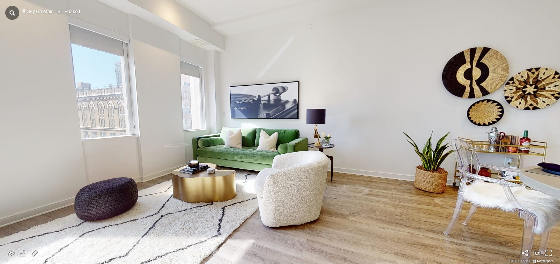 a kitchen with white walls and a wooden floor