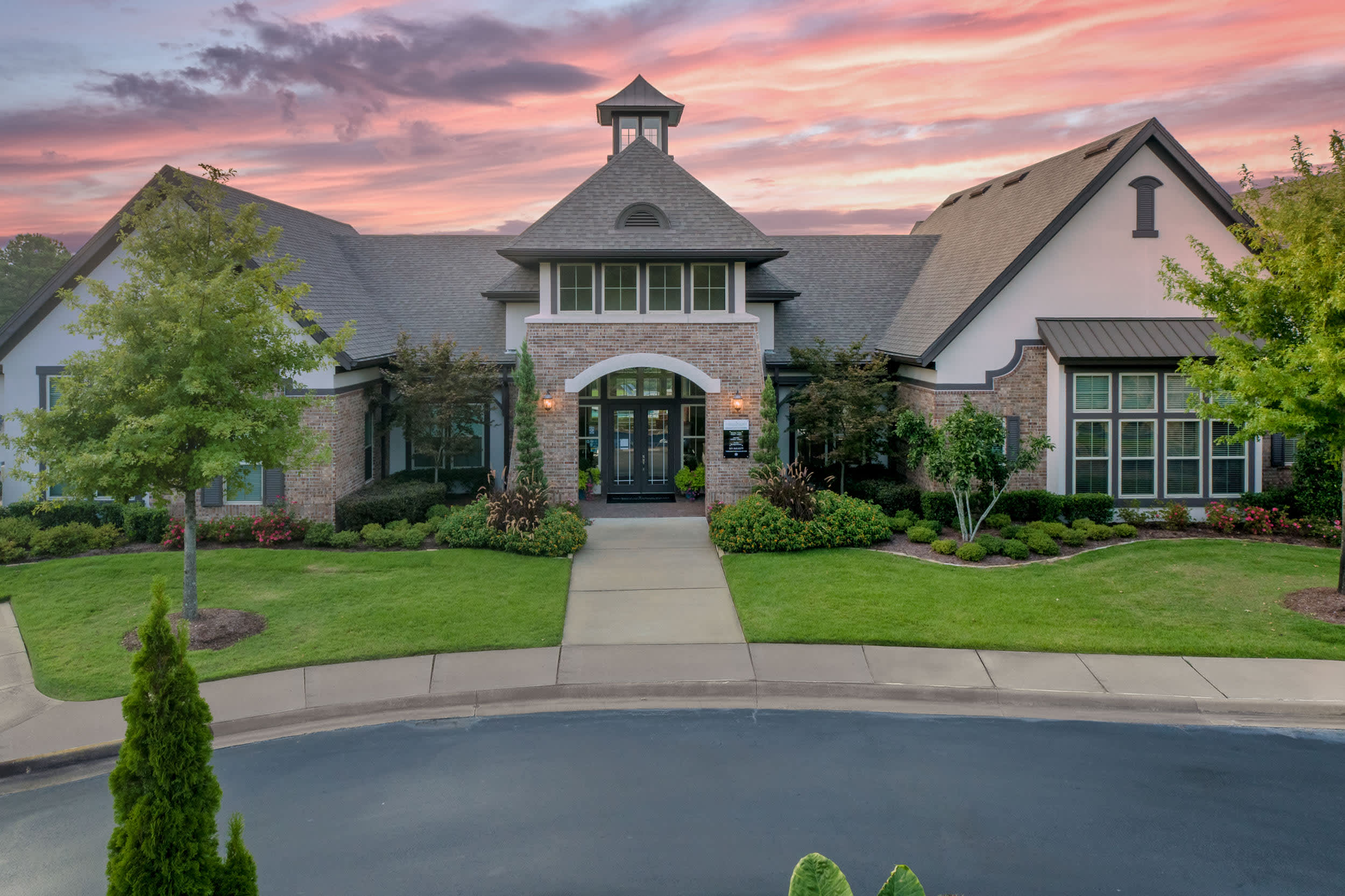 The Ridge at Chenal Valley Apartments clubhouse exterior at night - Little Rock, AR