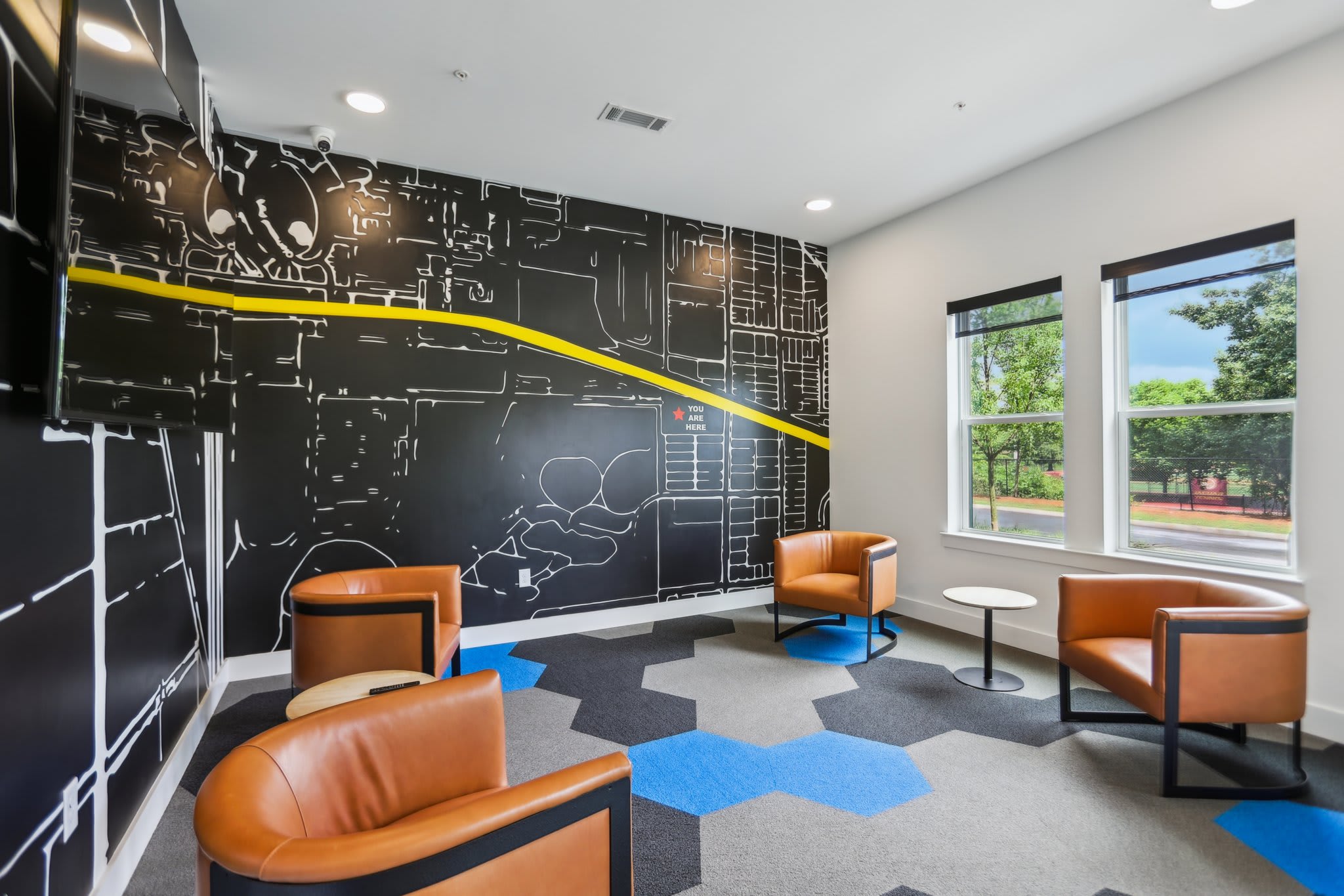 Resort-style pool and sundeck at The Argos Apartments - Atlanta, GA