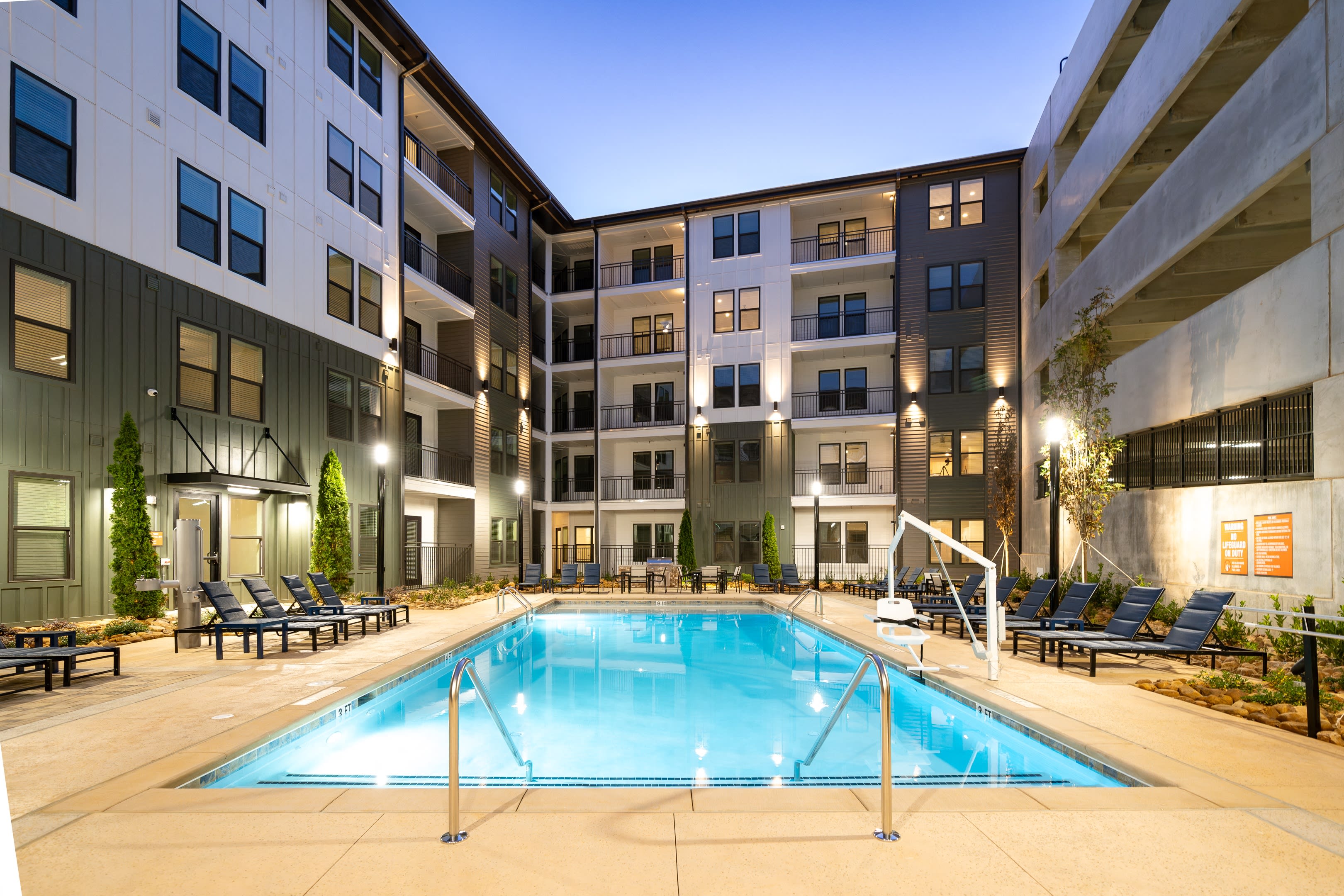 The Argos Apartments exterior illuminated at twilight - Atlanta, GA
